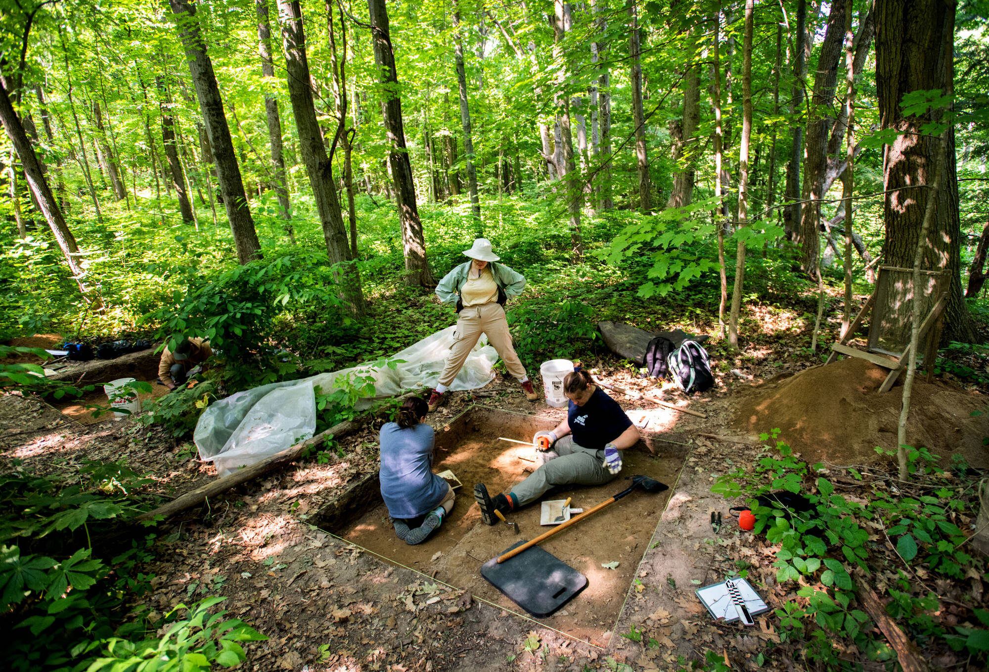 Arlo Van Conant, center, watches as two fellow students work on an archeology dig for Steven Dorland’s anthropology 307 class.(Photo releases on file)